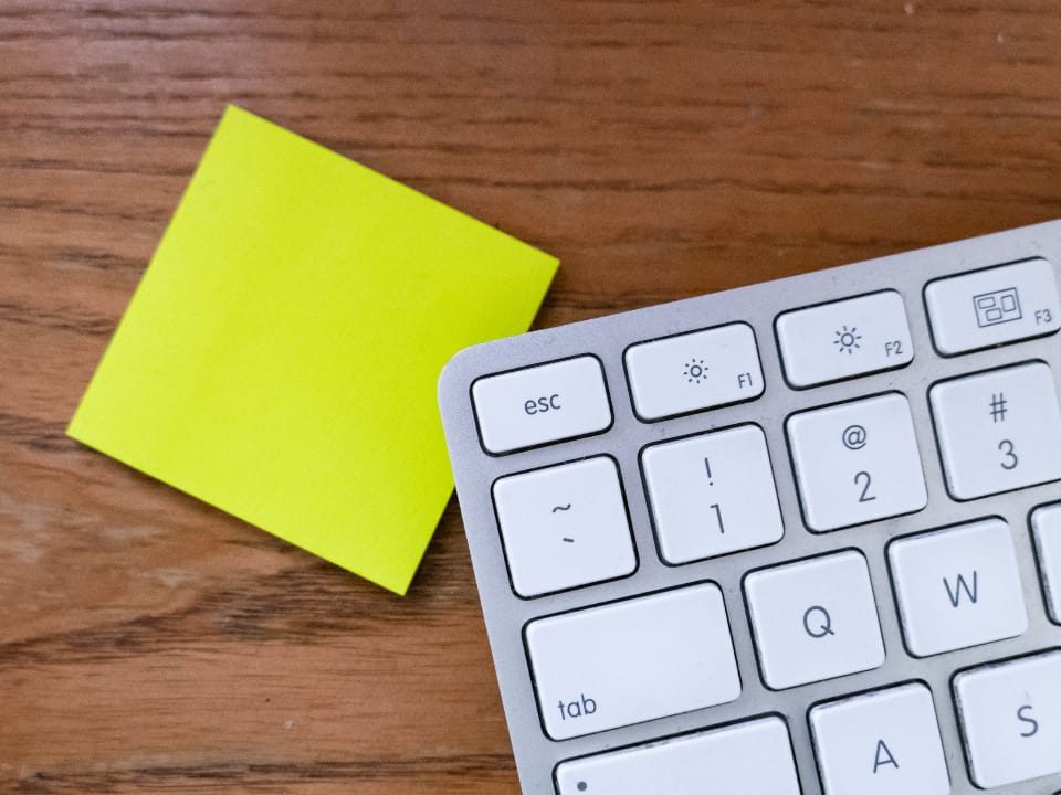 post it notes and keyboard at online company