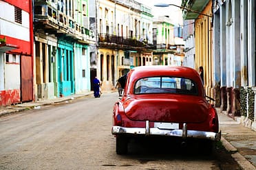 Street scene with vintage car in Havana, Cuba